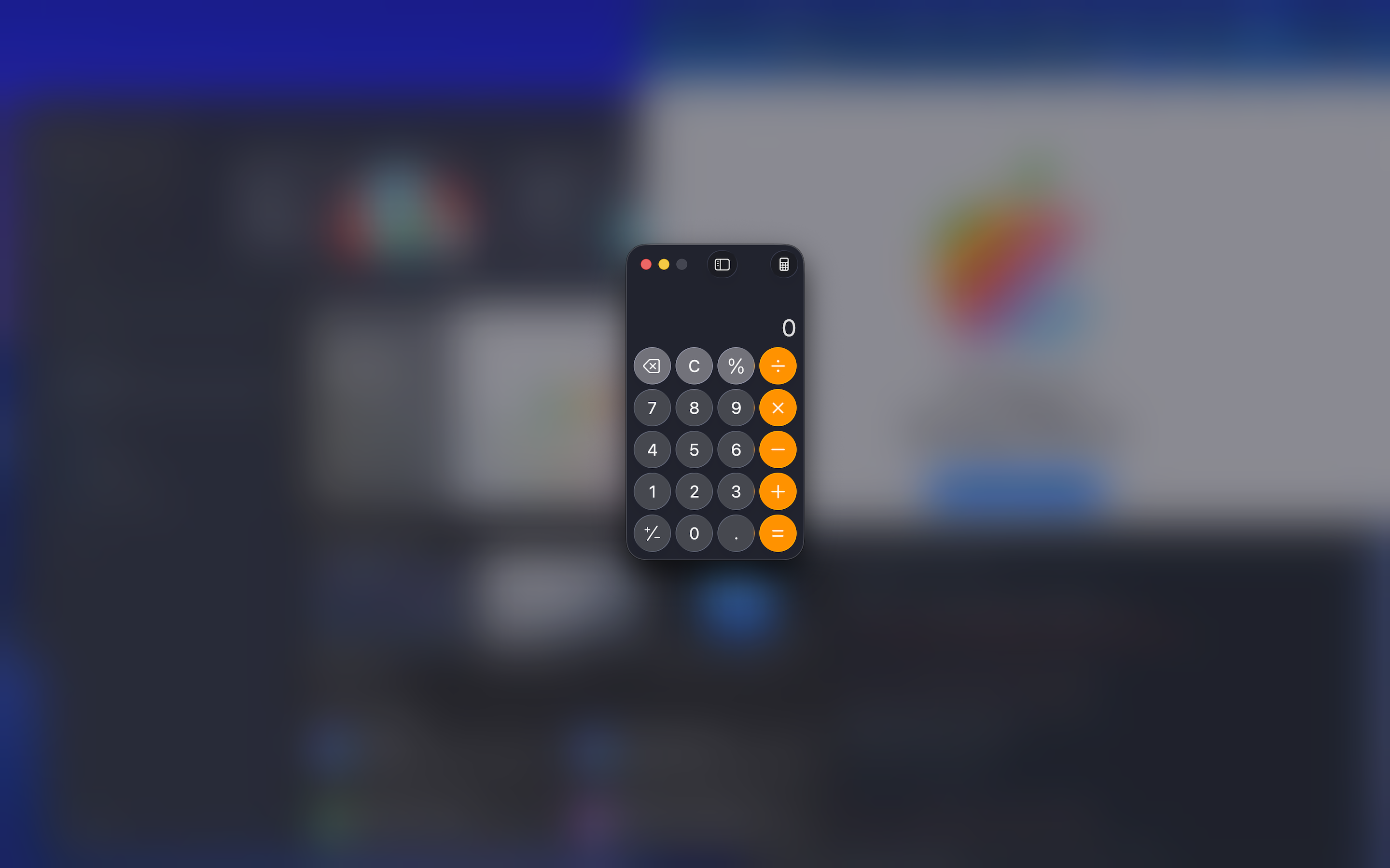 Calculator remains clear in the foreground while the rest of the desktop is blurred